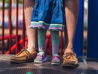 Image of people standing on playground equipment Image of people standing on playground equipment