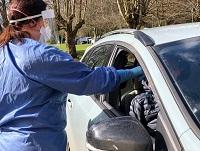 Image of person in car being test for coronavirus