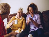 Image of social care worker with client