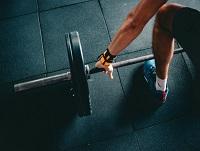 Image of a person lifting weights Image of a person lifting weights