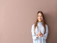 Young woman using signing language