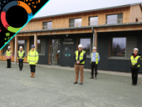 Image of people outside the new Welshpool Church in Wales Primary School