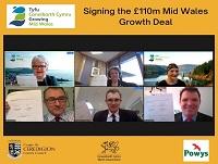 Image of English screengrab of people signing Heads of Terms or Mid Wales Growth Deal