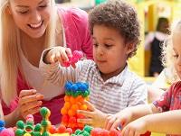 Image of young woman playing with a boy