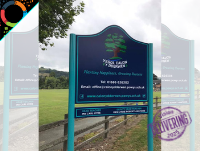 Image of Ysgol Calon y Dderwen school sign with English branding