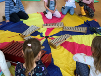 Image of children playing music