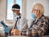 A hospital volunteer supporting a patient