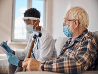 A hospital volunteer supporting a patient