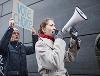 A woman using a megaphone to get her point across