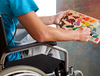 Image of a wheelchair user mixing paints