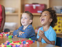 Image of 2 toddlers laughing
