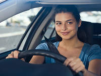 A care worker driving an electric car