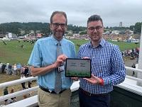 Cllr James Gibson-Watt and Cllr Matthew Dorrance with a digital copy of the Vision for Powys