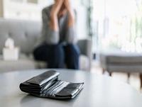 An empty purse on a coffee table