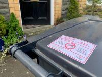 Image of a wheeled bin with a 'no food waste' sticker