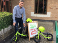 Cllr David Selby with a balance bike