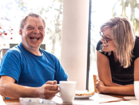 Two people smiling and laughing