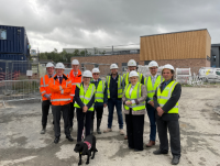 Image of Rebecca Evans MS, Minister for Finance and Local Government, Cabinet Members and council officers outside the new school for Ysgol Cedewain