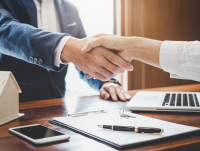 Image of two people shaking hands