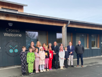 Image of Cllr Pete Roberts, Cabinet Member for a Learning Powys, presents one of the trophies to a learner from Welshpool Church in Wales Primary School