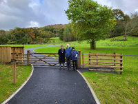 Image of three people at the Y Plas Cemetery in Machynlleth