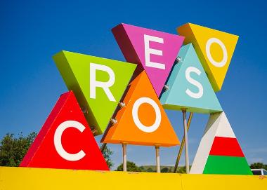 Colourful triangles that spells the word Croeso