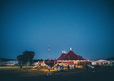 Marquees on the Urdd Eisteddfod Maes at night