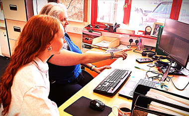 Photo of Joni at a desk