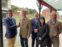 Powys County Council Cabinet Members, Matthew Dorrance (left) and Jake Berriman mark the handover of the site on Temple Street to Housing Services (from the Strategic Property Team), watched by fellow Cabinet Member Pete Roberts; Chief Officer – Place, Ma