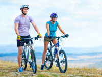 Two people cycling in the countryside