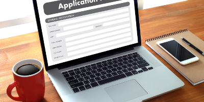 A laptop being used to make an application