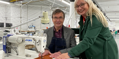 People using a sewing machine