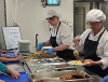 Image of school cooks serving school dinners