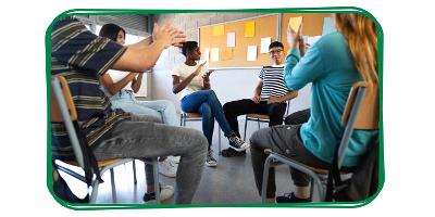 Image of a group of young people sat around in a circle