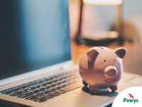 Image of a piggy bank on a laptop