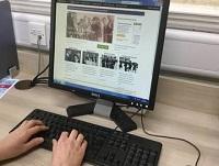 Image of someone doing research on a computer