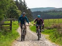 Image of two people on mountain bikes Image of two people on mountain bikes
