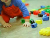 Image of a child with Lego