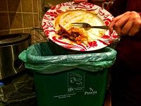 Image of food waste going into a food bin