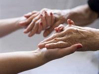 Image of two people holding hands