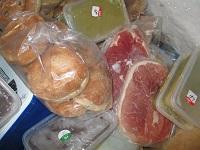 Image of raw meat and ready to eat food stored together in freezer