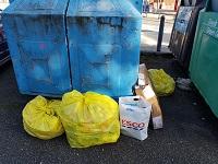 Image of fly-tipping outside a recycling bank