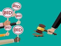 Image of people bidding at auction