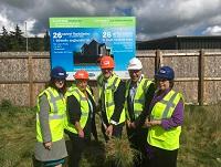 Image of people at turf-cutting ceremony in Newtown Image of people at turf-cutting ceremony in Newtown
