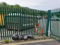 Image of fly-tipping outside a household waste recycling centre