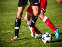 Image of two players playing football Image of two players playing football