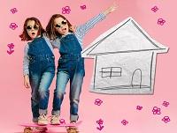Image of two young girls next to a hand drawn house