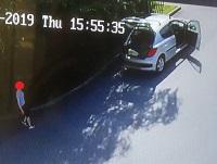 Image of CCTV still of person fly-tipping