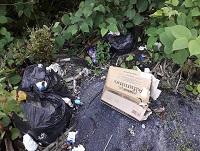Image of rubbish fly-tipped in a layby