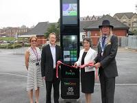 Image of people cutting a ribbon at an opening ceremony for a transport interchange Image of people cutting a ribbon at an opening ceremony for a transport interchange